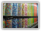 Candy Wall - The candy wall is a main attraction at any type of event. Set ups offer ten different candy choices - all well known brands such as m&m's, candy corns, Gummie Bears and more….. Kids get a small bag to fill with a variety of their favorite treats and take home as a party favor.