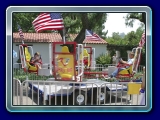 Whirley Bird Ride -  A 4-person, manually powered spinning ride for both kids and adults at your next party. The riders control how fast they whirl by working as a team, pushing and pulling the handle bars in front of them. The faster they pump, the faster the ride. 